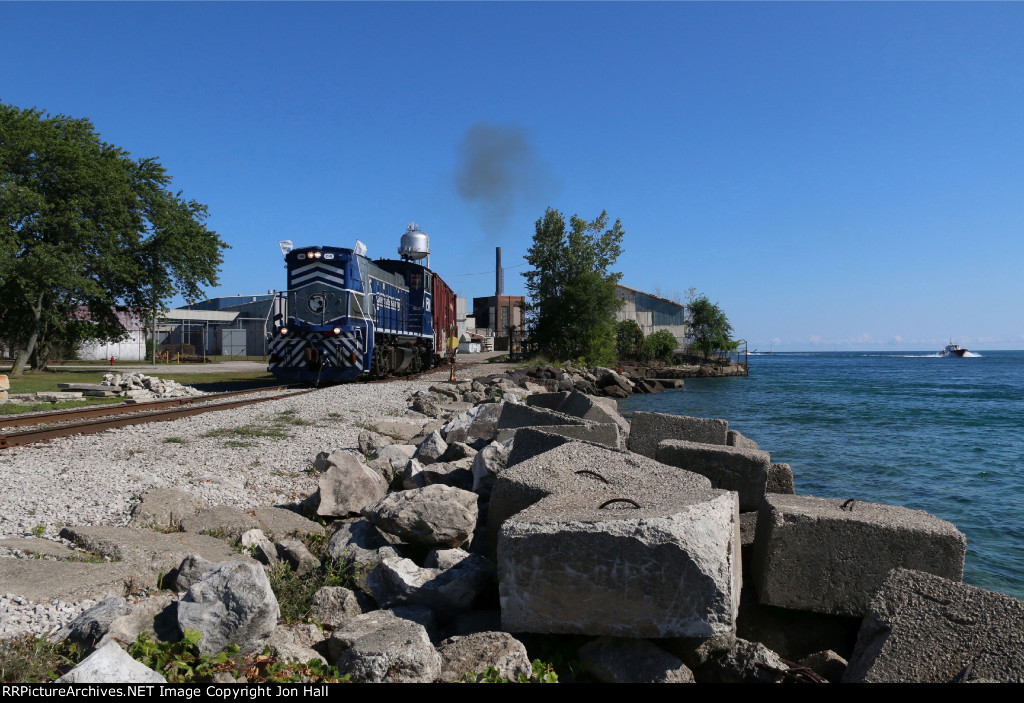 1501 sits as a boat comes in to the river from Lake Huron